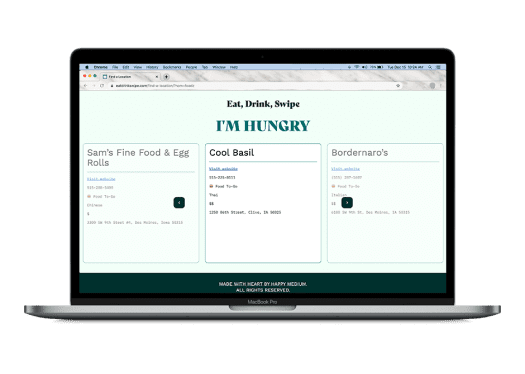 A laptop displays a website