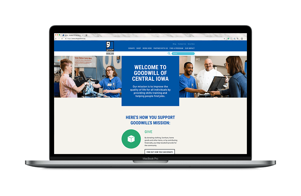 A laptop displays Goodwill website