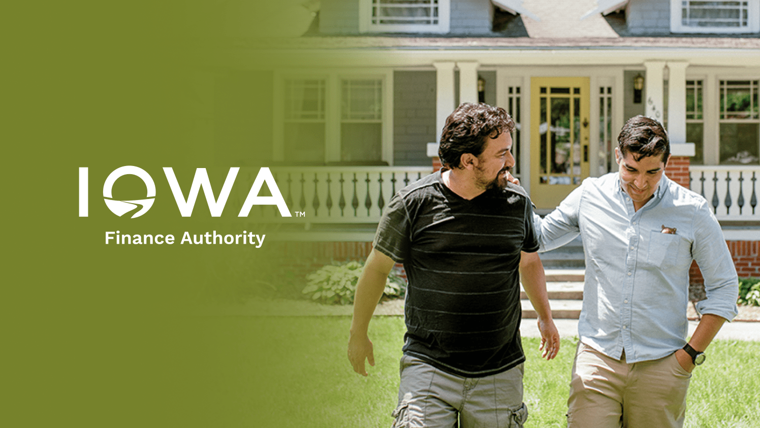 A photo of a father and son walking in front of the home they just bought.